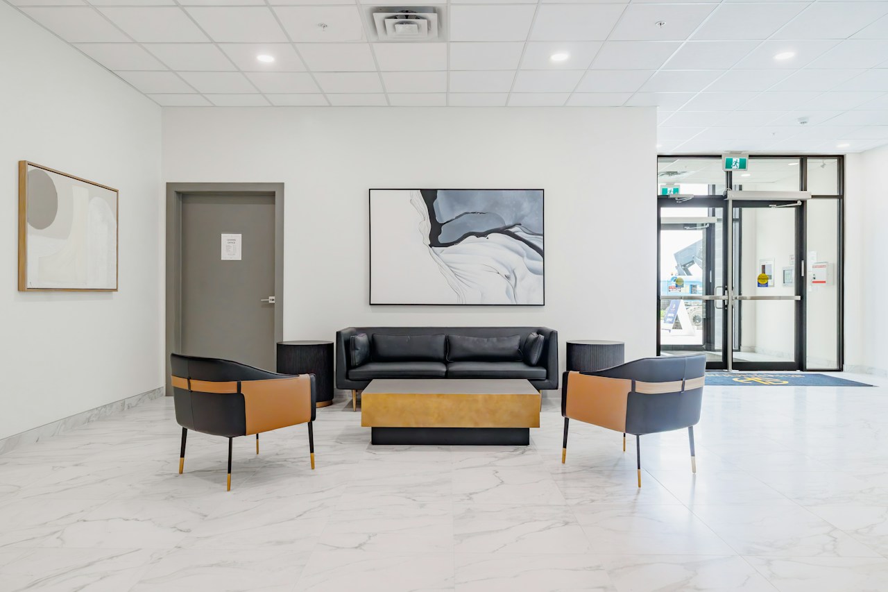 A bright, uncluttered waiting lounge with comfortable chairs in a health and wellness website concept.
